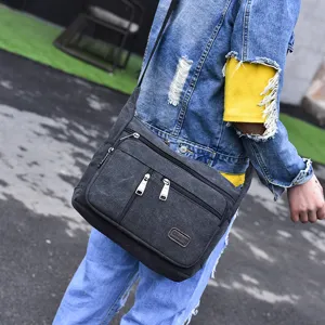 Casual dark gray canvas messenger bag for men with multiple zipper compartments for daily use
