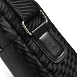 Detailed view of durable black oxford cloth shoulder bag with reinforced metal buckle