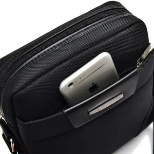 Durable black Oxford cloth men's messenger bag showing smartphone storage in front pocket