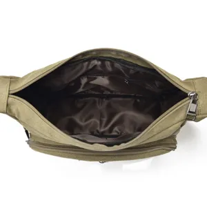 Top view of a men's large capacity canvas crossbody bag showing multi-compartment interior