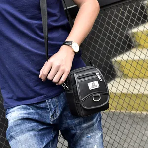 Modern black Oxford cloth small crossbody bag for men shown in a lifestyle setting