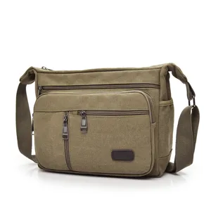 Durable men's olive green canvas messenger bag with multi-zipper compartments for travel