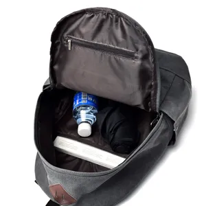 Grey vintage canvas backpack for men showing large interior capacity for water and umbrella