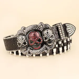 Detailed close-up of a heavy punk style black belt with skull buckle and bullet rivets