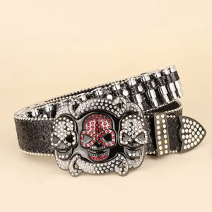 Detailed view of black hip-hop punk belt featuring rhinestone skulls and silver bullet rivets