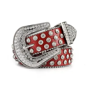 Close-up of red leather belt with sparkling rhinestones and studded cowboy buckle detail