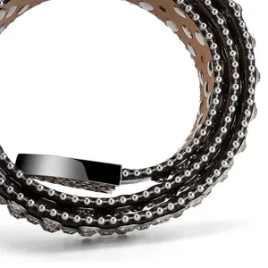 Macro detail of fashionable punk belt with sparkling rhinestones and silver bead chain trim