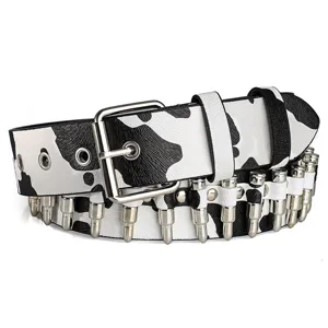 Macro view of punk cow print belt featuring decorative silver bullet-shaped rivets.