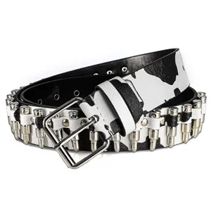 Detail view of a punk cow print belt with silver bullet metal studs and buckle.