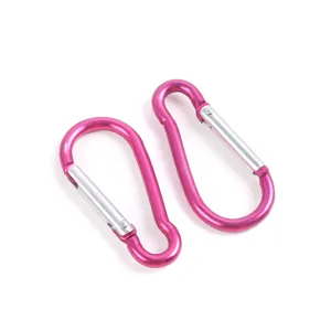 Pink aluminum alloy carabiner detail view, durable spring clip for outdoor backpack and water bottle.