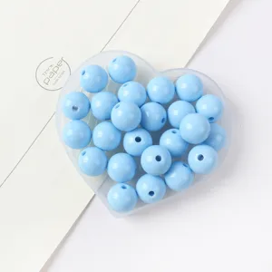 Close-up detail view of light blue acrylic round beads for creative DIY jewelry making projects.