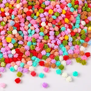 Resin flower nail art details, colorful tiny floral pieces for DIY phone case decorations.
