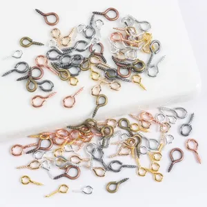 Detailed view of mixed color metal screw eye pins, assorted sizes for DIY craft jewelry making.