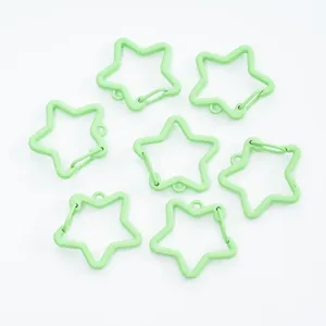 Detailed view of light green star-shaped spring clasps for DIY jewelry and keychains