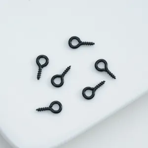 Detailed shot of black screw eyes, metal eyelets loop pins for DIY jewelry making and crafts.