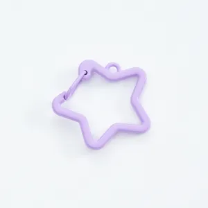 Macro detail of a purple lacquered star-shaped spring hook clasp for DIY jewelry making