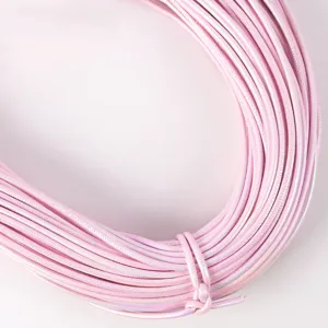 Macro detail of 5mm pearlescent pink PU leather stitched cord for DIY jewelry making