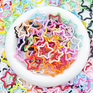 Close-up macro view of colorful star-shaped lobster clasps for DIY jewelry and keychains.