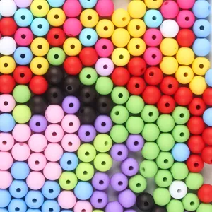 Macro view of multi-colored frosted acrylic beads for DIY jewelry making projects