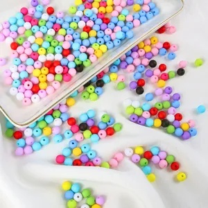 Macro view of colorful matte acrylic macaron beads for DIY jewelry making