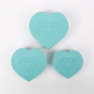 Detailed view of three sizes of heart-shaped turquoise diamond painting sorter trays