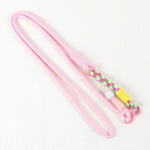 Pink phone lanyard detail woven strap, adjustable cross body cord accessory part.