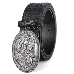 Macro detail view of a western cowboy belt featuring an ornate engraved metal buckle