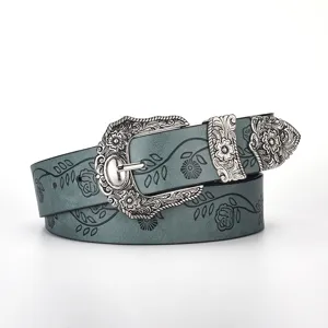 Retro carved buckle teal leather belt with embossed leaf and clover floral patterns.