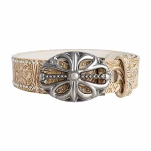 Detailed view of the embossed leather western cowboy belt with vintage silver cross buckle.