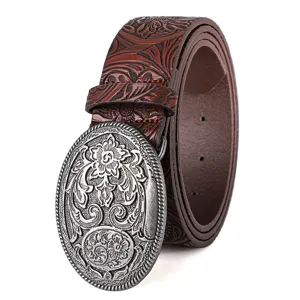 Close-up of vintage Western belt with carved silver buckle and floral embossing