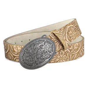 Detailed view of western cowboy belt with vintage floral embossed leather and metal buckle
