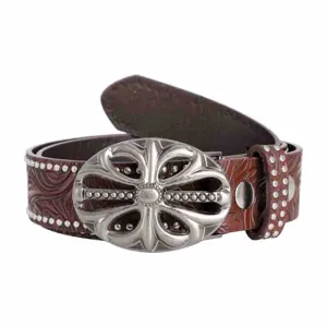 Western vintage embossed leather belt with ornate floral metal buckle and studded edges