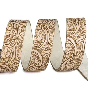 Close-up of embossed peony floral patterns on a retro western style leather belt