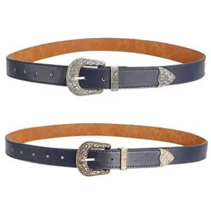 Detailed view of retro carved metal buckle on navy blue belts with silver and gold finishes.