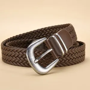 Close-up of brown braided PU leather belt with vintage silver-finish metal buckle.