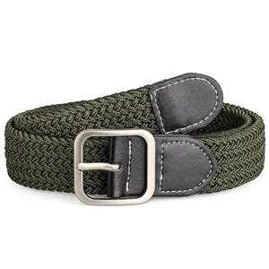 Close-up of the army green woven elastic belt, highlighting the durable metal pin buckle.