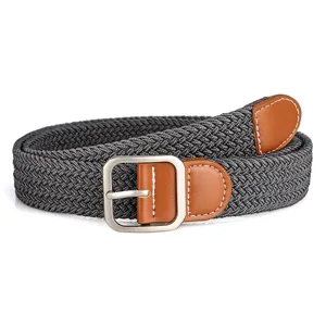 Dark grey woven elastic belt with brown leather ends and silver metal pin buckle for women.