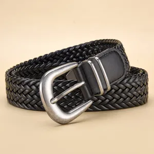 Close-up of black braided PU leather belt with vintage silver metal pin buckle.