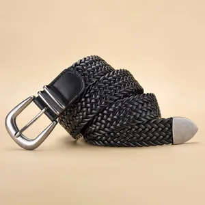 Close-up of black PU woven belt texture with retro silver metal pin buckle detail