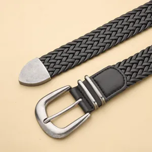 Macro detail showing the black PU braided texture and vintage silver metal pin buckle