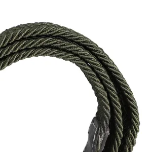 Close-up detail of military green braided canvas belt with leather tip and neat stitching.
