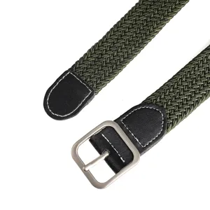 Close-up detail of the green braided elastic belt showing the metal buckle and leather ends.