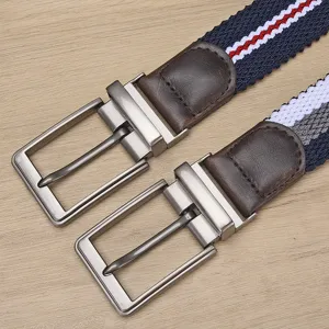 Close-up van heren gevlochten stretch riem met metalen draaibare gesp en mooie textuur.