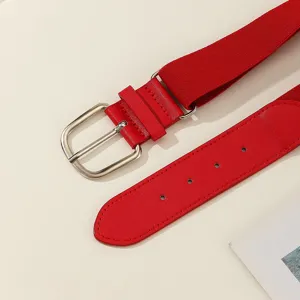 Detail view of a vibrant red elastic woven belt with a sturdy silver metal buckle and PU end