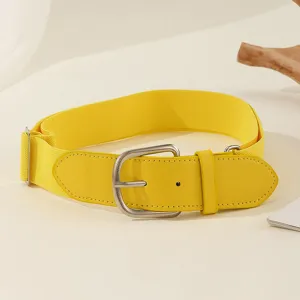 Close-up of bright yellow elastic baseball belt with silver buckle and PU leather details