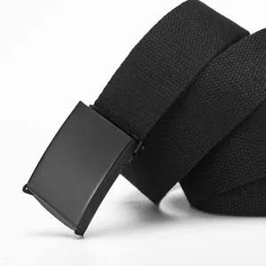 Close-up detail of black canvas tactical belt with metal automatic buckle for men casual wear.