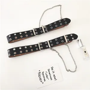 Women punk style black leather belt with double eyelets and metal chain, cool accessory.