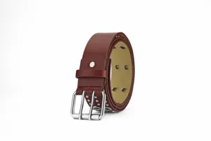 Punk style dark red leather belt detail showing double metal buckle, grommets and studs.