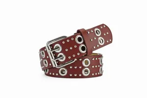 Punk style dark red leather belt with double grommets and metal studs for fashion outfits.