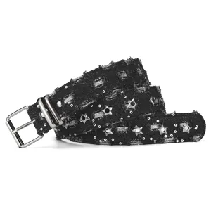 Punk style black denim belt detail featuring star grommets, sequins, and double metal pin buckle.